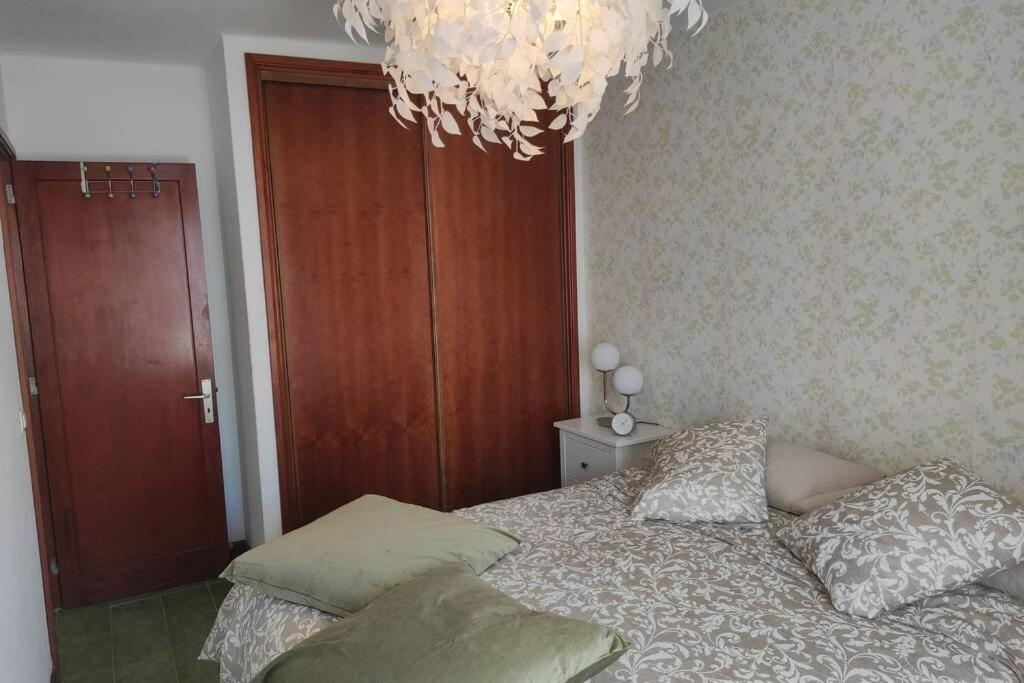 A bed or beds in a room at Apartamento BellAloe
