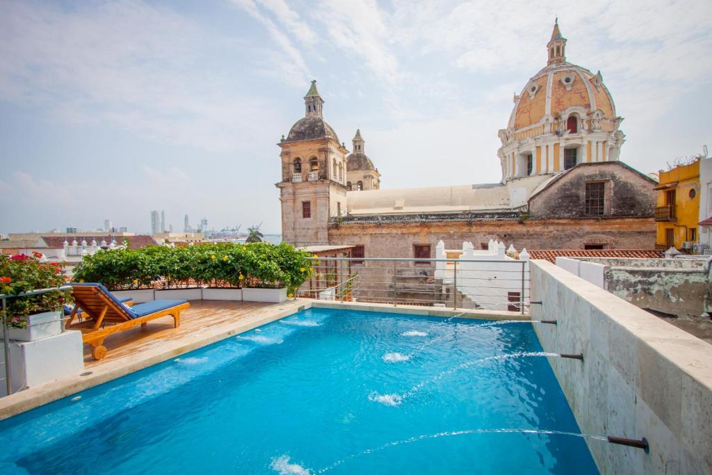 a swimming pool on the roof of a building at Casa Claver Loft Boutique Hotel in Cartagena de Indias