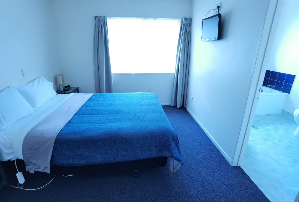 Voodi või voodid majutusasutuse Harringtons Motor Lodge toas
