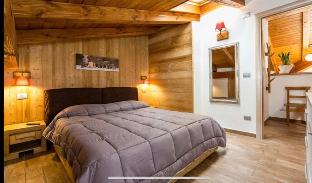 Posteľ alebo postele v izbe v ubytovaní Sottosopra Alps Apartments & Rooms