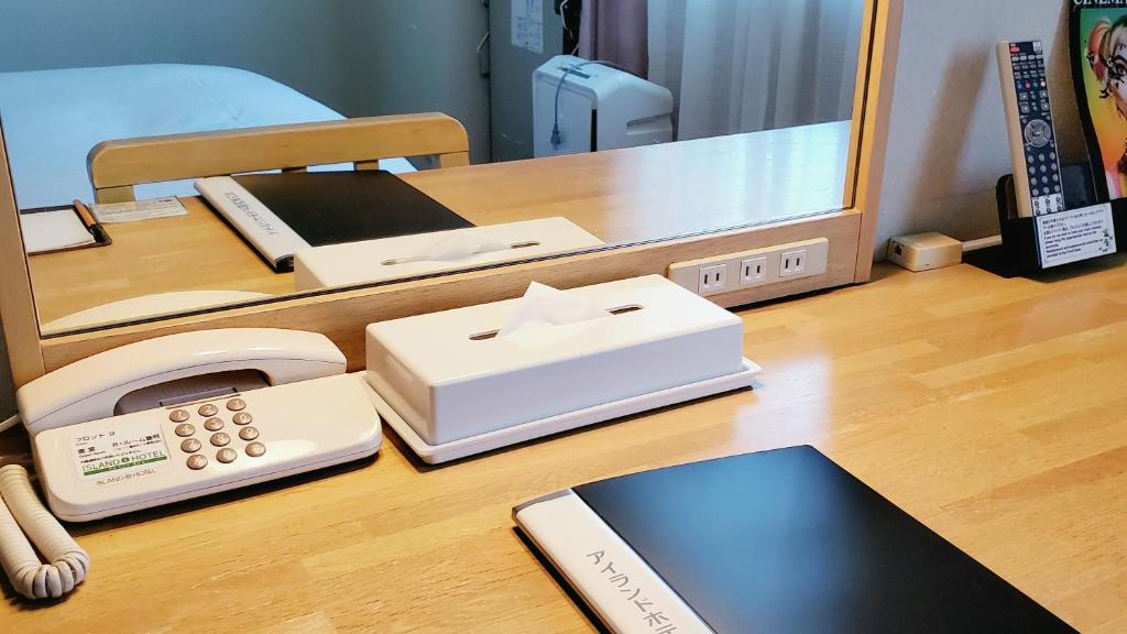TV a/nebo společenská místnost v ubytování Island Hotel