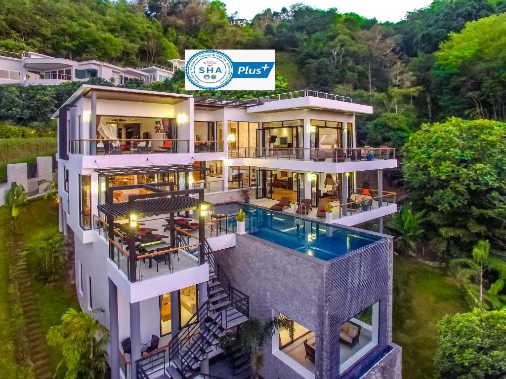 an aerial view of a house with a swimming pool at Fully Serviced Grand Villa Luxury Time Phuket in Bang Tao Beach