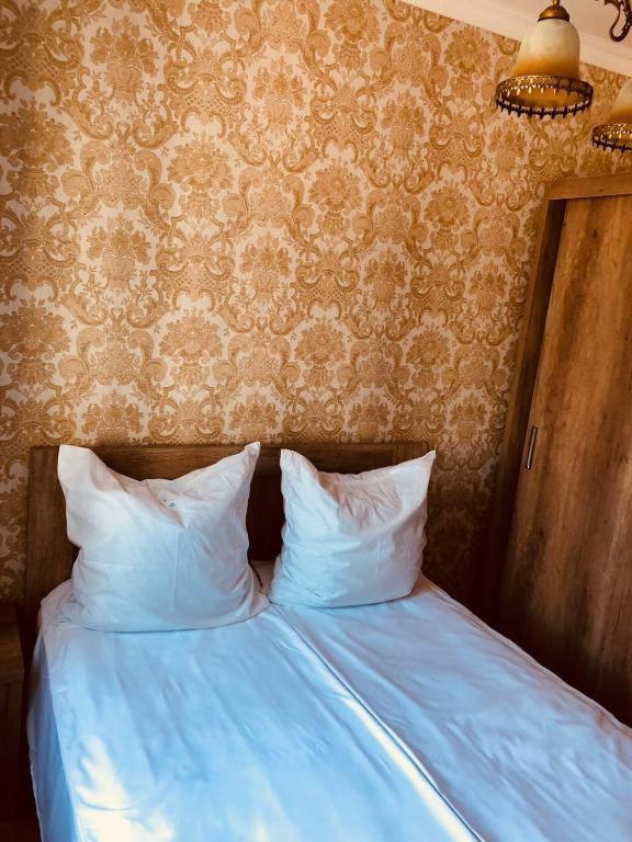 Postel nebo postele na pokoji v ubytování Apartment OLD KUTAISI