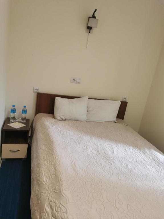 Postel nebo postele na pokoji v ubytování Prymus
