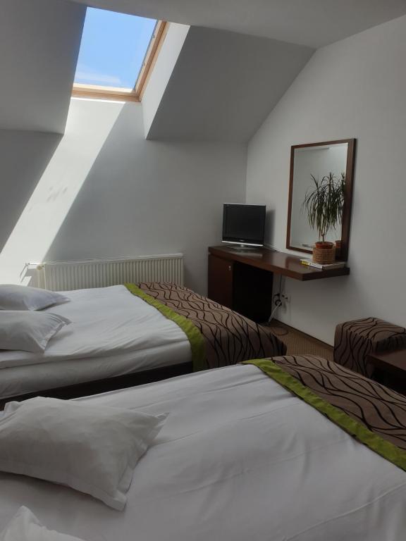 Postel nebo postele na pokoji v ubytování Hotel MEITNER