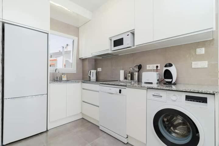 A kitchen or kitchenette at Apartment with pool TORREVISTA ROCIO