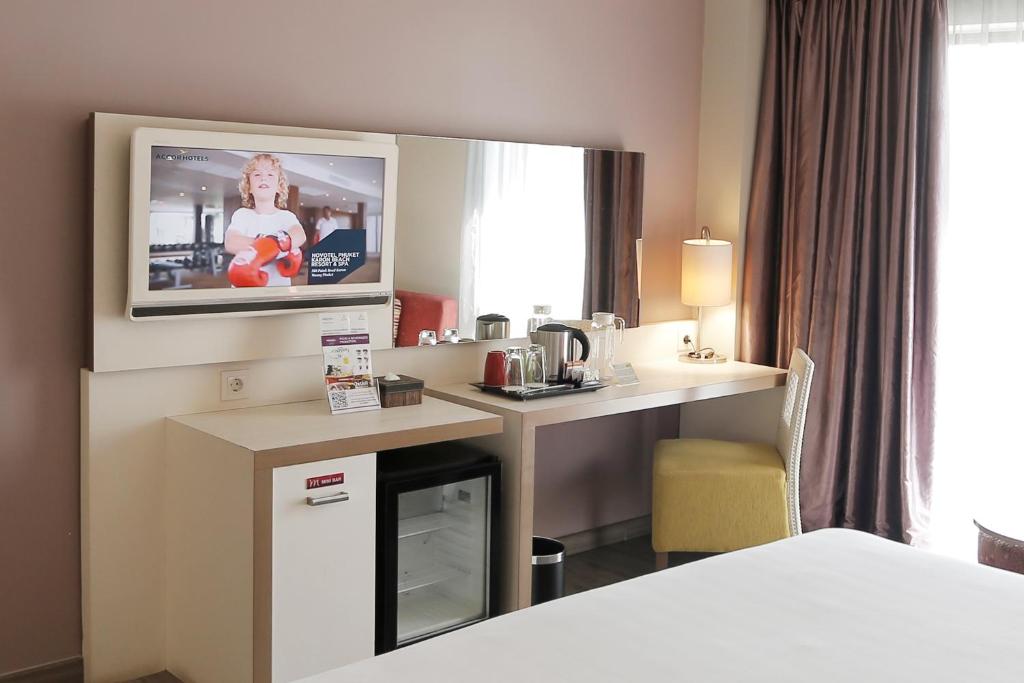 Postel nebo postele na pokoji v ubytování Mercure Padang