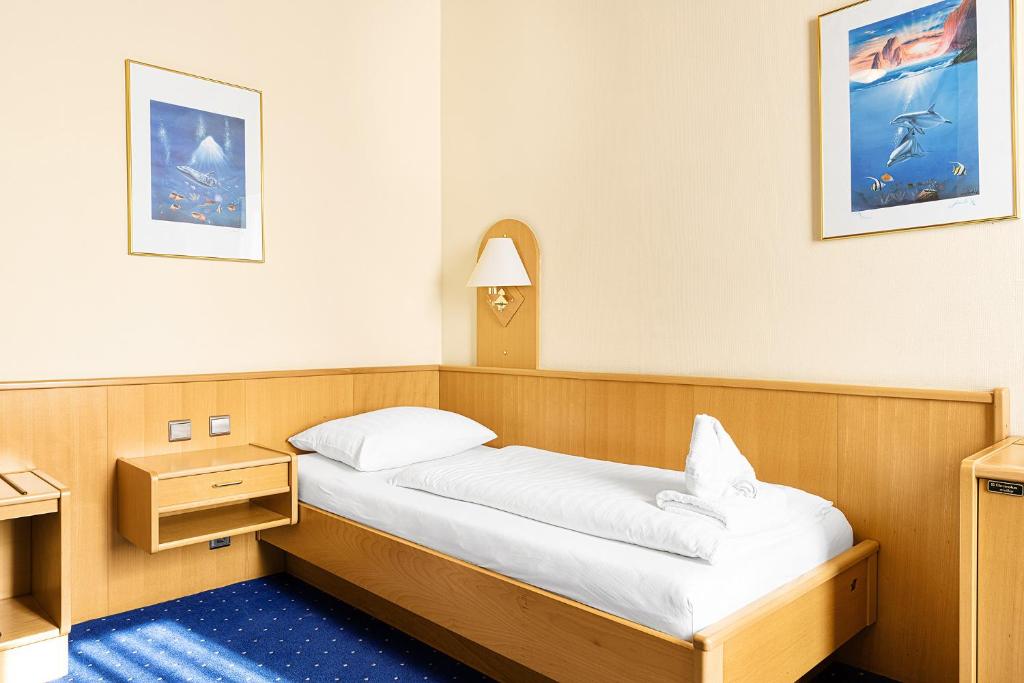 Postel nebo postele na pokoji v ubytování Hotel-Pension Wild