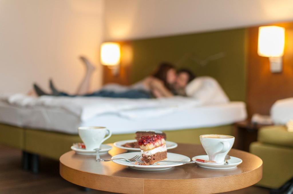 Postel nebo postele na pokoji v ubytování Christophs Hotel