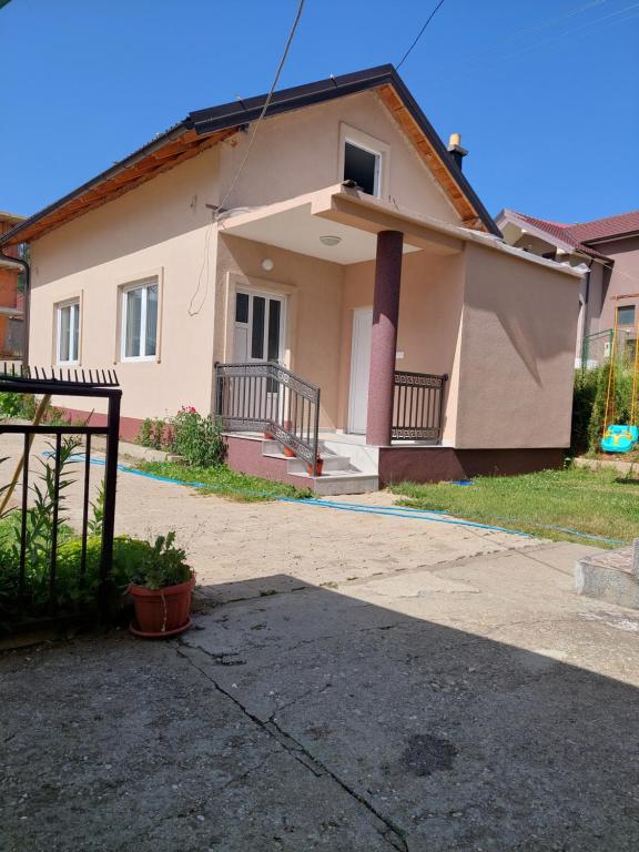 a small house with a driveway in front of it at Sara Apartments Plav in Plav