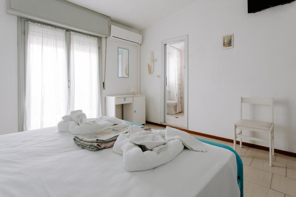 Postel nebo postele na pokoji v ubytování Hotel Edward