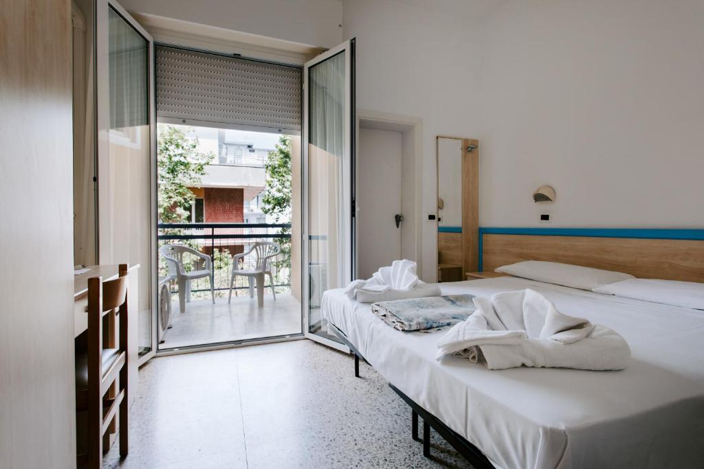 Postel nebo postele na pokoji v ubytování Hotel Edward