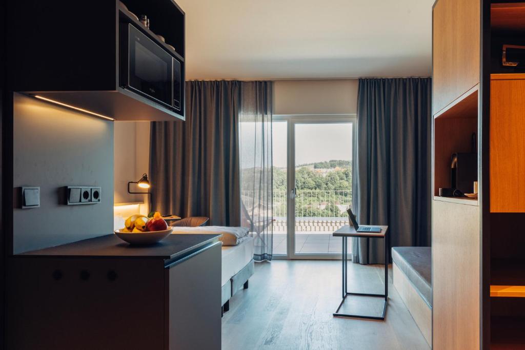 Köök või kööginurk majutusasutuses harry's home Steyr hotel & apartments