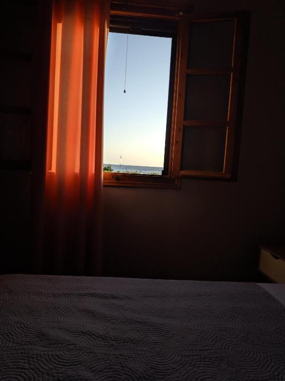 Postel nebo postele na pokoji v ubytování Tramonto Nel Delfini