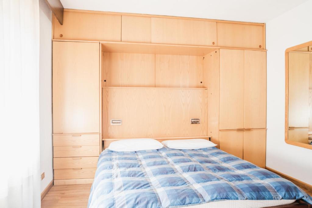 Postel nebo postele na pokoji v ubytování Residence Dolomia