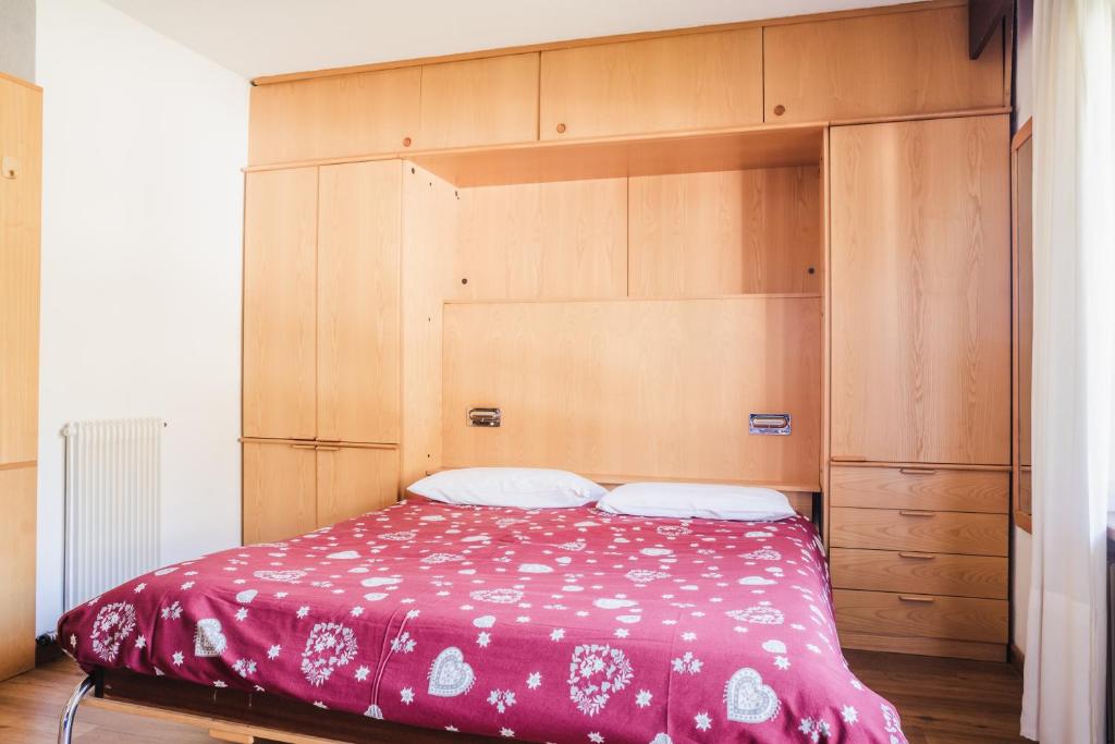 Postel nebo postele na pokoji v ubytování Residence Dolomia