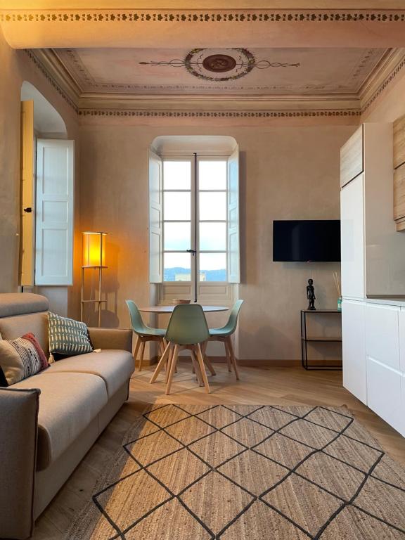 a living room with a couch and a table at Corallini Luxury Apartments - Apartment Aka in Cervo