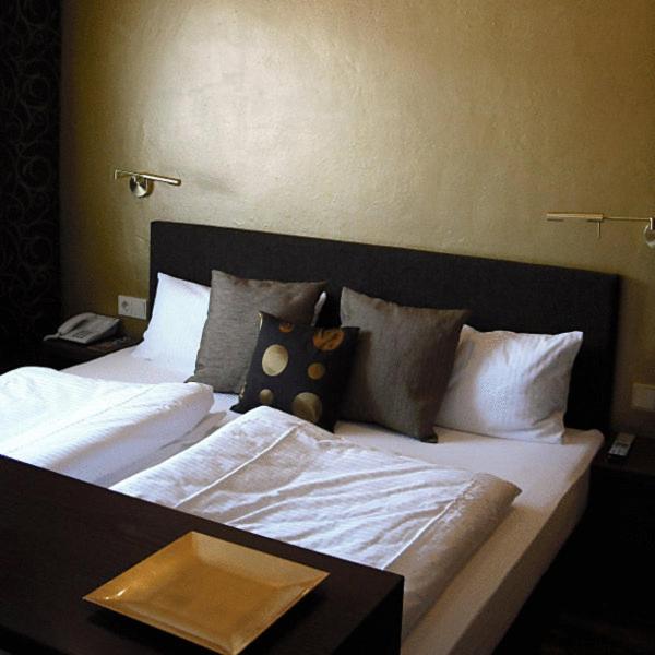 Postel nebo postele na pokoji v ubytování Hotel Kolb