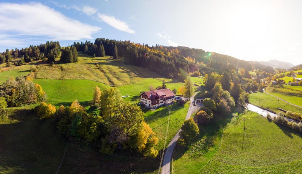 an aerial view of a house in the middle of a field at Gästehaus Schlegel in Gunzesried