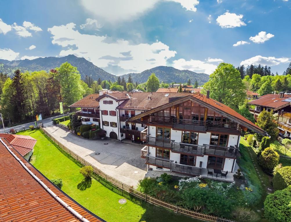 an aerial view of a house with a yard at Hubertus Apartments in Schliersee