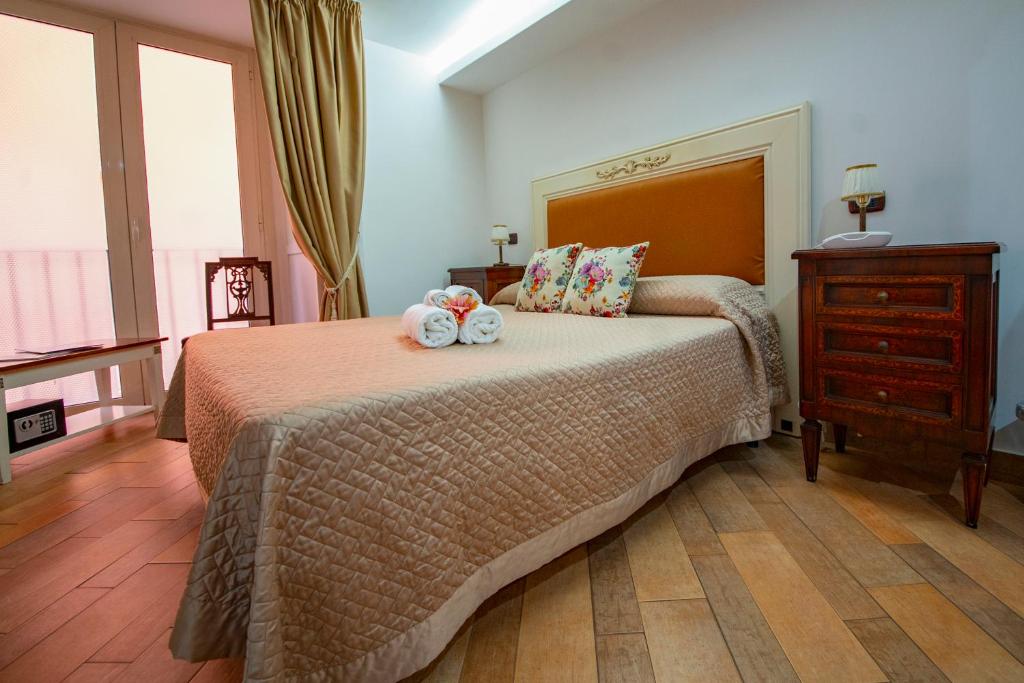 Postel nebo postele na pokoji v ubytování Hotel Lanfipe Palace