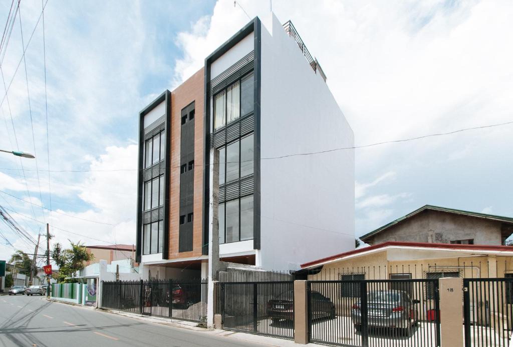 a building on the corner of a street at RedDoorz at Good 101 Paranaque in Manila