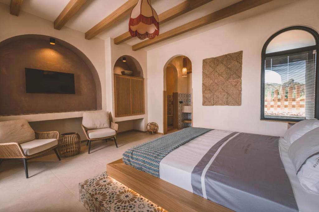 Postel nebo postele na pokoji v ubytování Turunç House Kayaköy