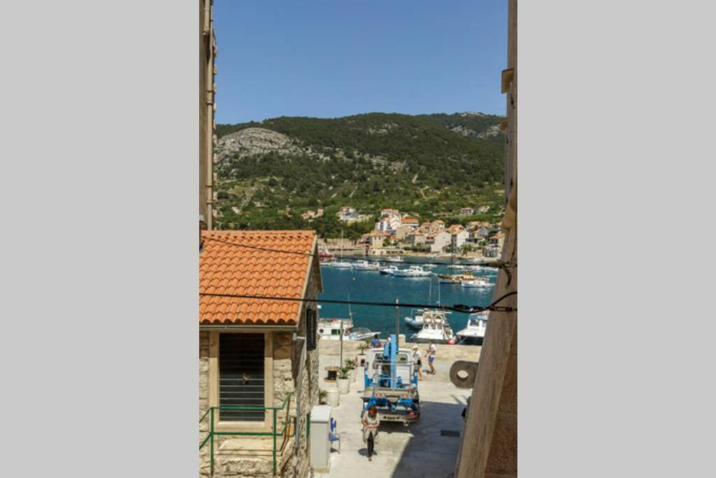 a view of a harbor from a clock tower at Apartment Eša in Komiža