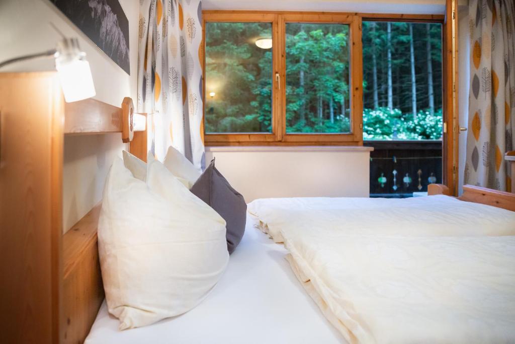 Posteľ alebo postele v izbe v ubytovaní Appartements Hochlega