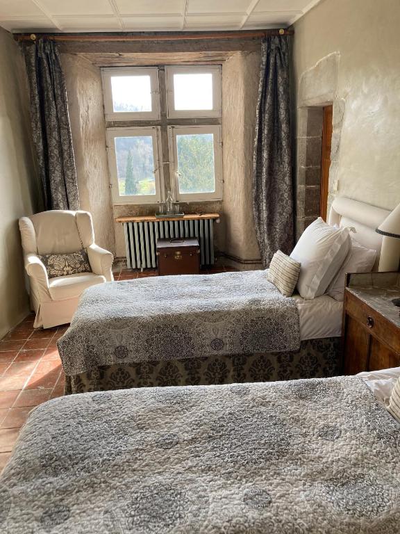 Postel nebo postele na pokoji v ubytování Château de Camon