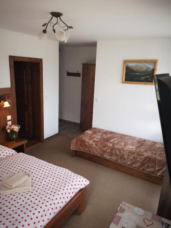Postel nebo postele na pokoji v ubytování Privát Bachleda Ždiar