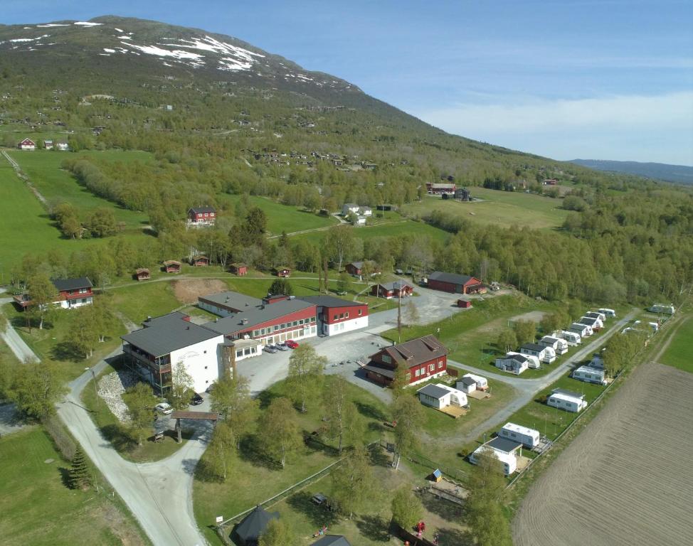 a small town with houses and cars on the side of the road at IMI Stølen in Oppdal