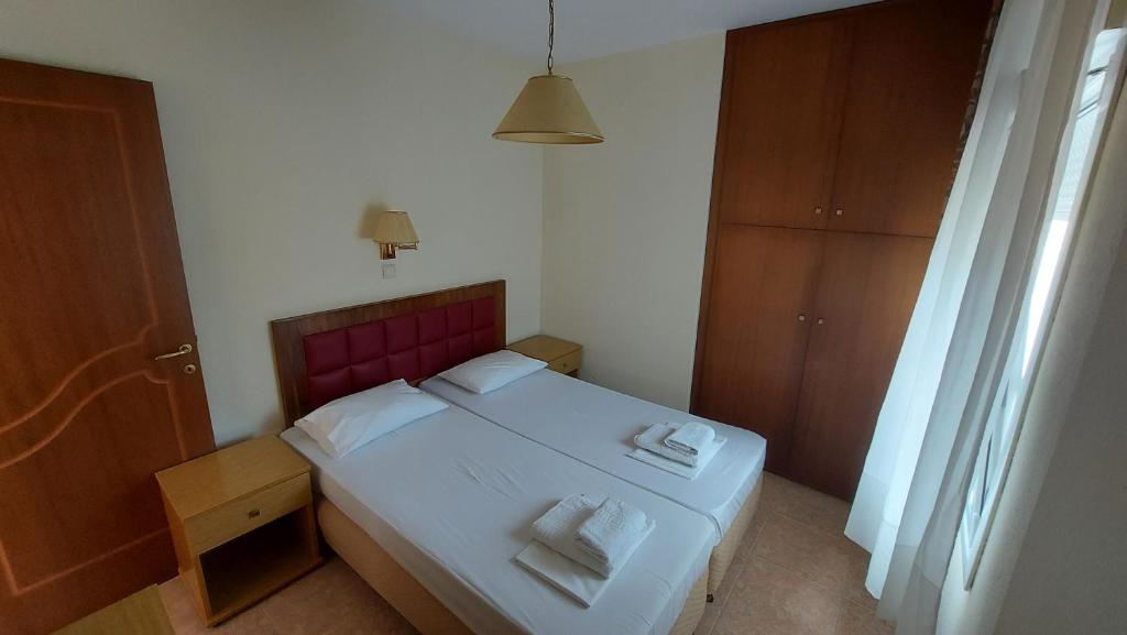 Postel nebo postele na pokoji v ubytování Hotel Kassandros