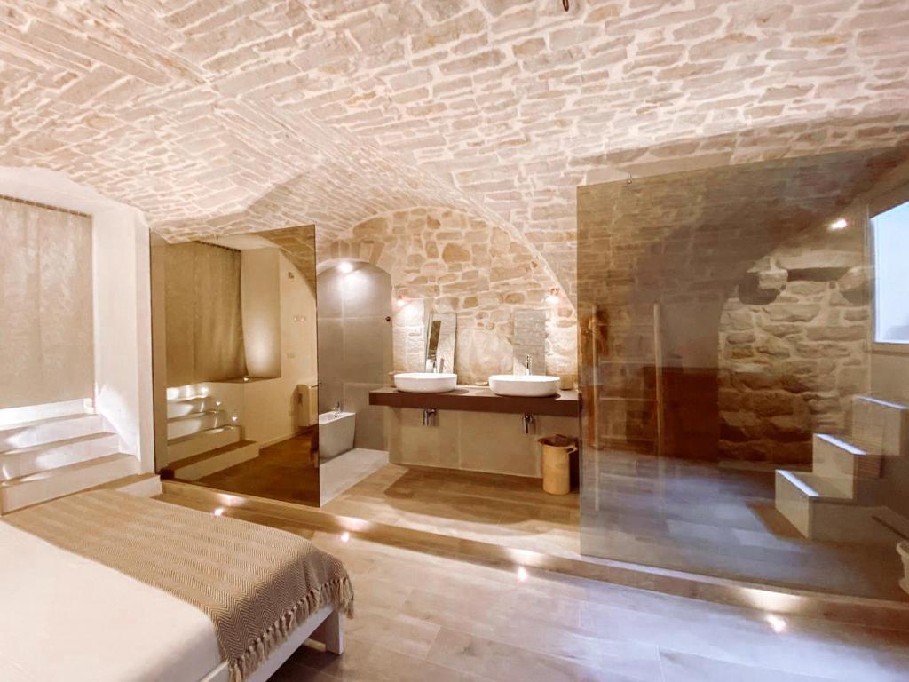 Łóżko lub łóżka w pokoju w obiekcie INDE Á LA TERRE, GUEST HOUSE Locazione Turistica