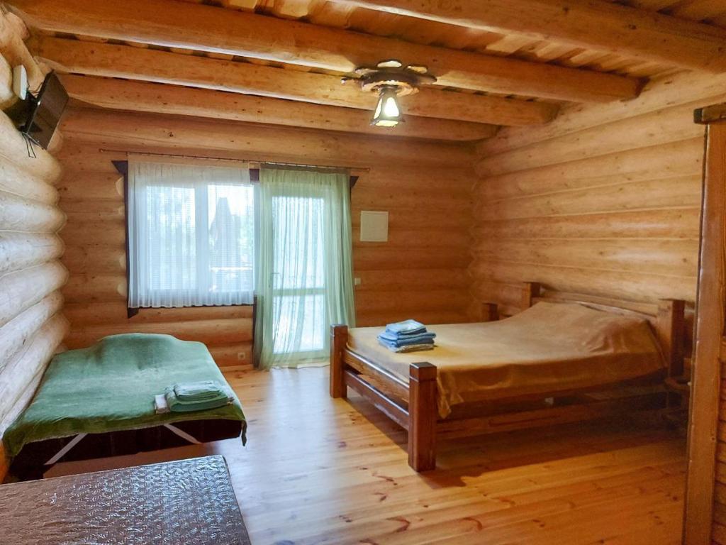 Postel nebo postele na pokoji v ubytování Эко-хаус