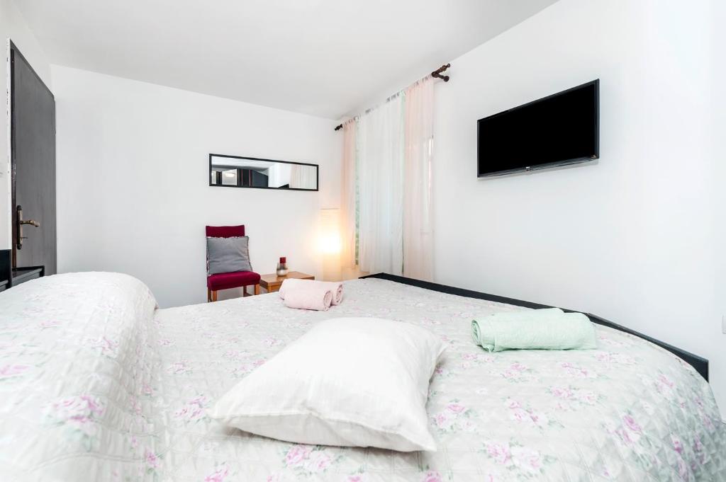 Postel nebo postele na pokoji v ubytování Apartment Pino