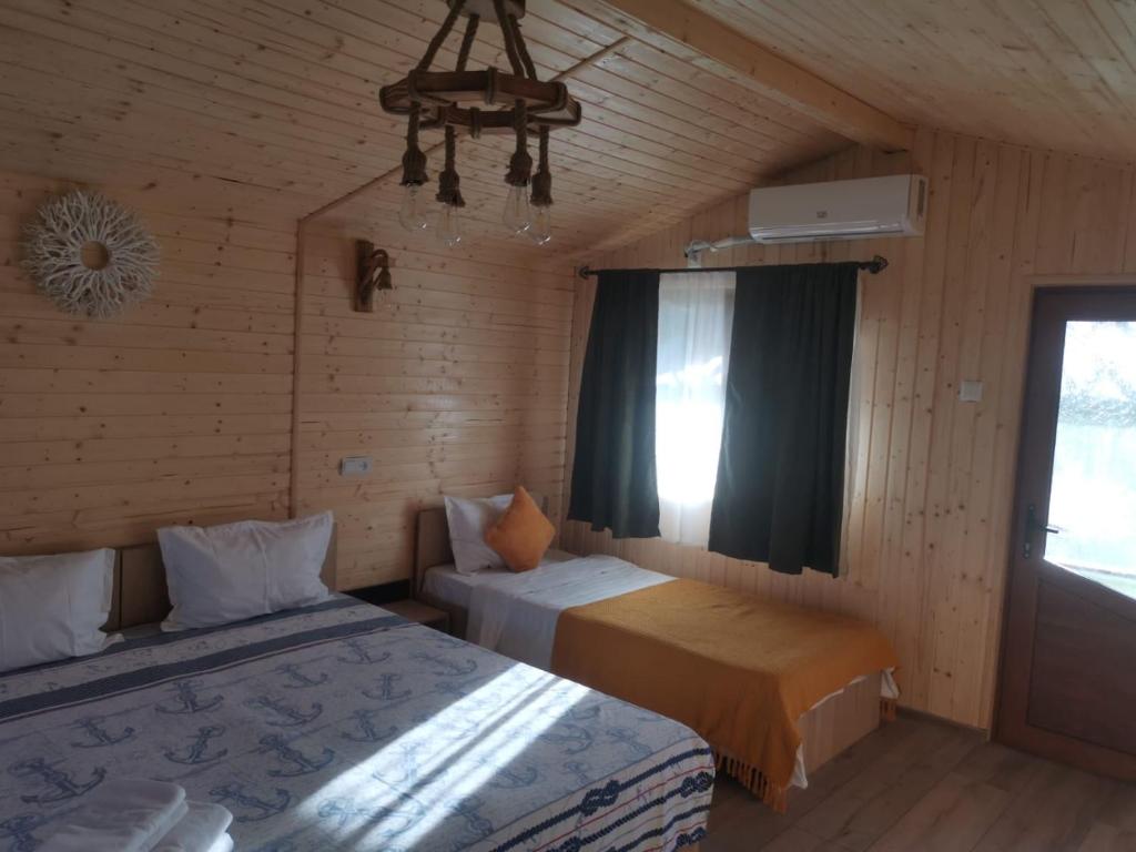 Postel nebo postele na pokoji v ubytování La 3 Casute