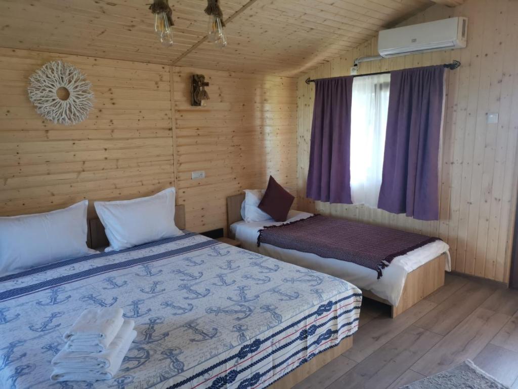 Postel nebo postele na pokoji v ubytování La 3 Casute