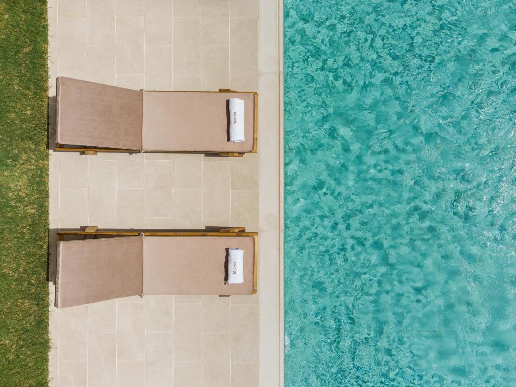 Bazén v ubytovaní Makris Luxury Rooms alebo v jeho blízkosti