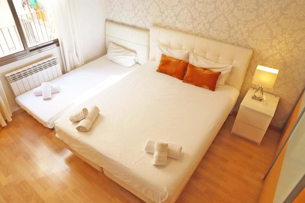 Posteľ alebo postele v izbe v ubytovaní Bcn-rentals apartments in the Old town