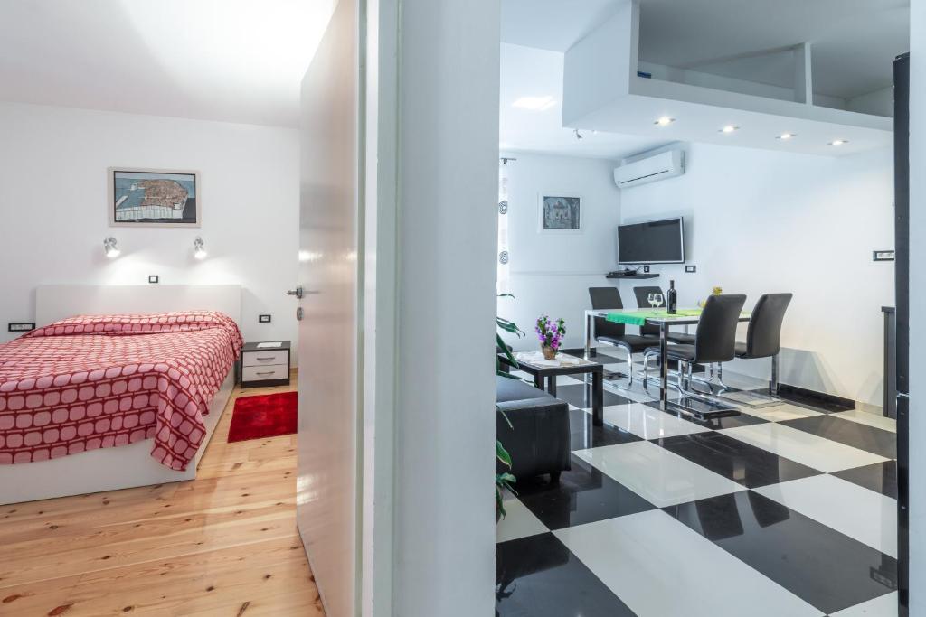 Televízia a/alebo spoločenská miestnosť v ubytovaní Apartment Giorgio
