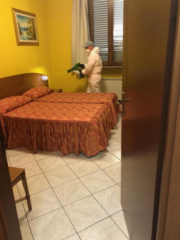 Postel nebo postele na pokoji v ubytování Hotel La Caravella