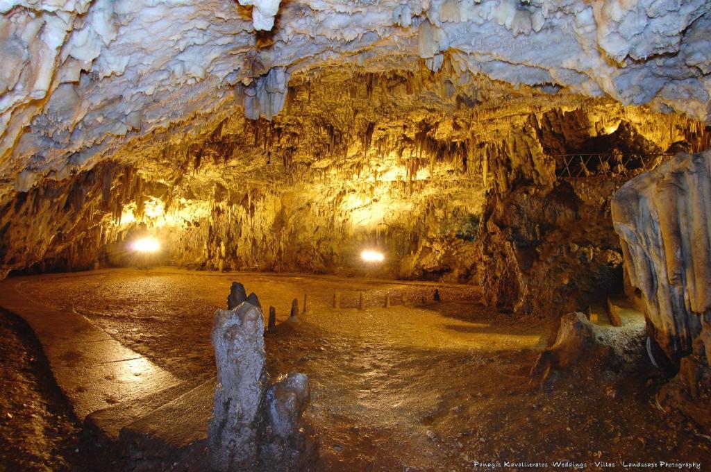 a cave with ice formations on the floor at Elisso Apartment in Argostoli