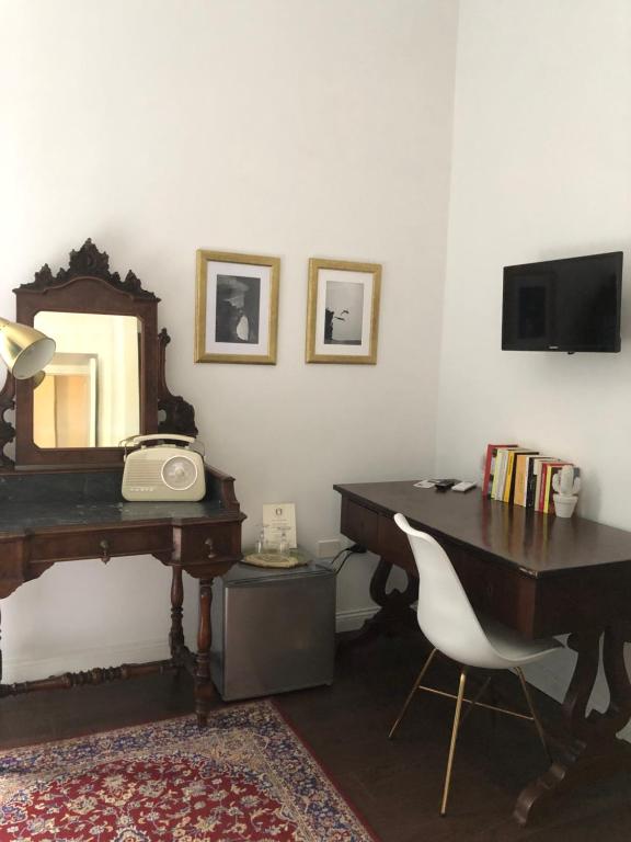 TV a/nebo společenská místnost v ubytování Ortigia Twin Rooms