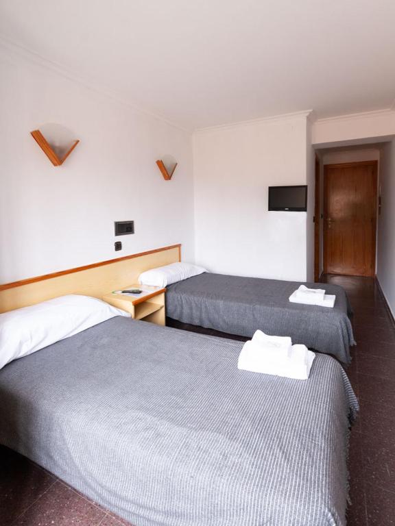 Postel nebo postele na pokoji v ubytování Hostal Gabás