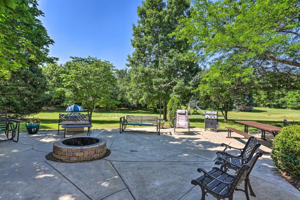 a patio with benches and a fire pit in a park at Southeast Michigan Escape about 3 Mi to Adrian! in Adrian