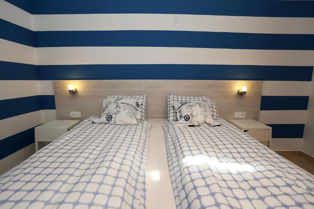 Postel nebo postele na pokoji v ubytování Guesthouse Villa Maggie