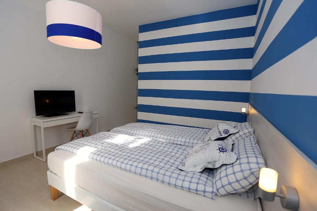 Postel nebo postele na pokoji v ubytování Guesthouse Villa Maggie
