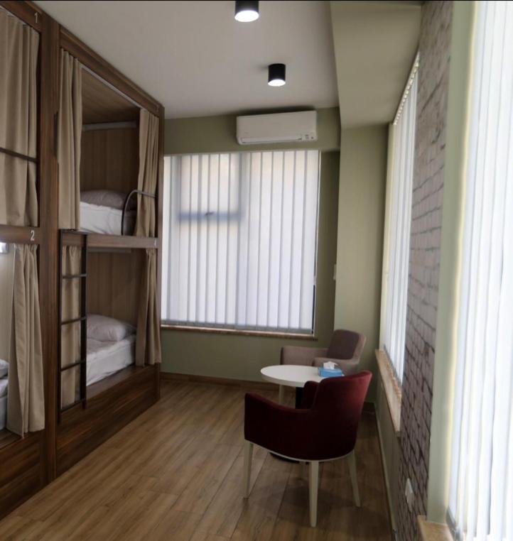 Postel nebo postele na pokoji v ubytování Loft Host Yerevan