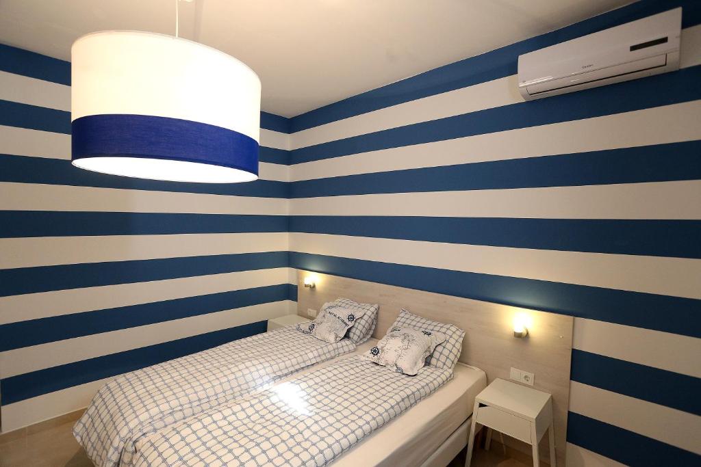 Postel nebo postele na pokoji v ubytování Guesthouse Villa Maggie